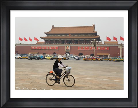 Framed Tourist riding a bicycle at a town square, Tiananmen Gate Of Heavenly Peace, Tiananmen Square, Beijing, China Print