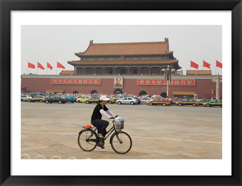 Framed Tourist riding a bicycle at a town square, Tiananmen Gate Of Heavenly Peace, Tiananmen Square, Beijing, China Print