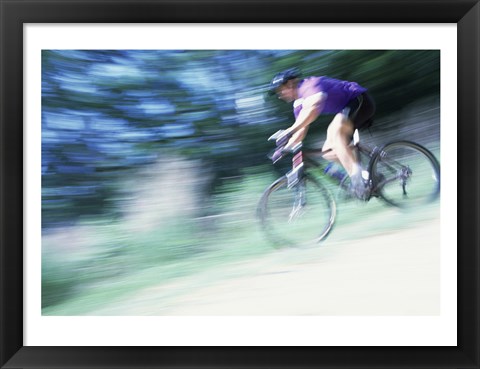 Framed Side profile of a young man riding a bicycle Print