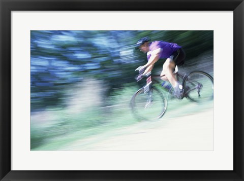 Framed Side profile of a young man riding a bicycle Print