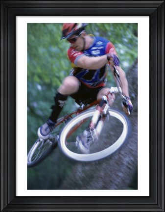 Framed Young man on a bicycle Print