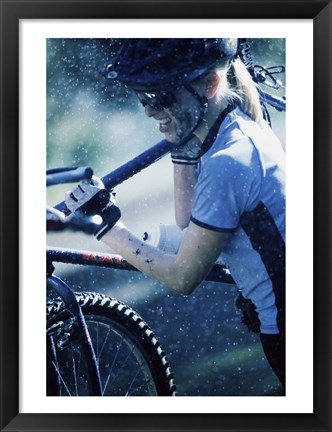 Framed Young woman carrying a bicycle on her shoulders Print