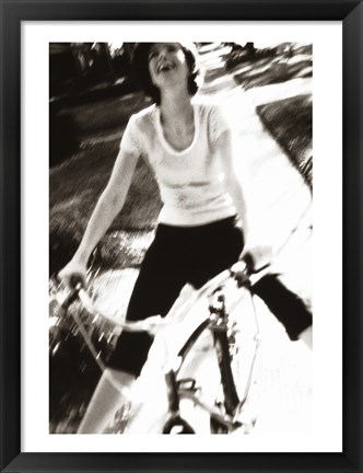 Framed Young woman riding a bicycle - black &amp; white Print