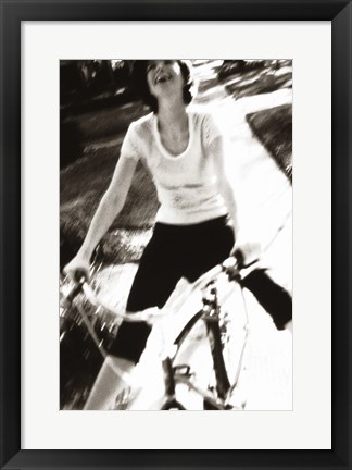 Framed Young woman riding a bicycle - black &amp; white Print