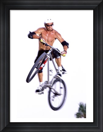 Framed Young man on a bicycle in mid-air Print