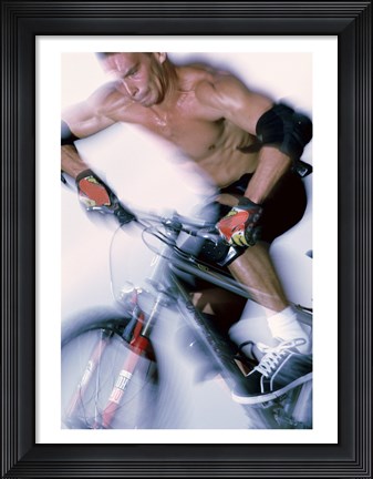 Framed Close-up of a young man riding a bicycle Print