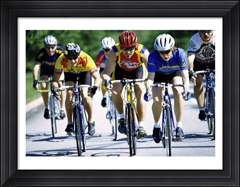 Framed Group of cyclists riding bicycles Print
