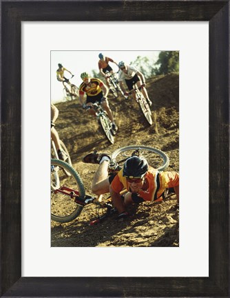 Framed Young man falling off his bicycle in a race Print