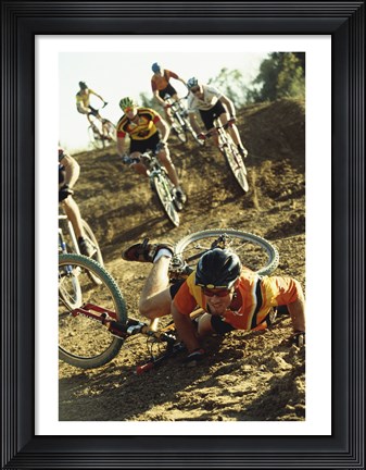 Framed Young man falling off his bicycle in a race Print