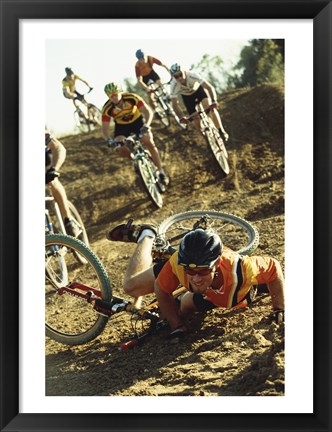 Framed Young man falling off his bicycle in a race Print