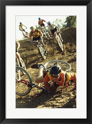 Framed Young man falling off his bicycle in a race Print