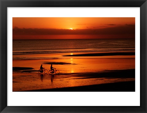 Framed Silhouette of a young couple cycling on the beach Print