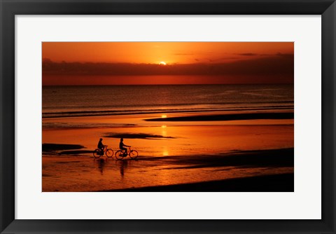 Framed Silhouette of a young couple cycling on the beach Print