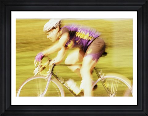 Framed Side profile of a young man cycling Print