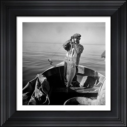Framed Hauling in a cod aboard a Portuguese fishing dory off Cape Cod, Massachusetts Print