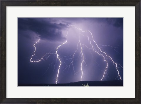 Framed Lightning bolts striking the earth Print