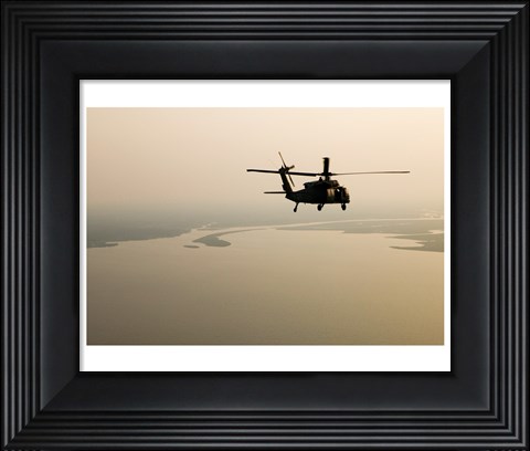 Framed Air Force helicopter flys over Lake Pontchatrain to New Orleans Print