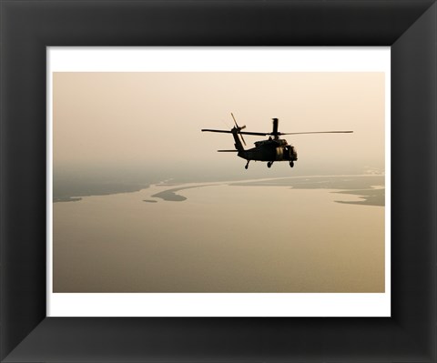 Framed Air Force helicopter flys over Lake Pontchatrain to New Orleans Print