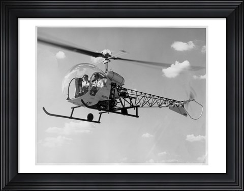 Framed Low angle view of two people sitting in a helicopter, Bell 47G-2 Print