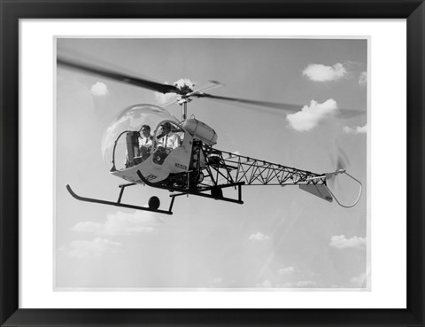 Framed Low angle view of two people sitting in a helicopter, Bell 47G-2 Print