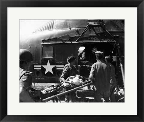 Framed Army soldiers carrying an injured person in a helicopter Print