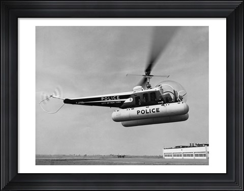 Framed Low angle view of a helicopter in flight, Bell 47-D, Bell Aircraft Corporation Print