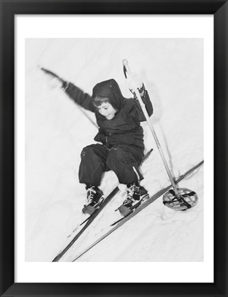 Framed Boy skiing on snow Print