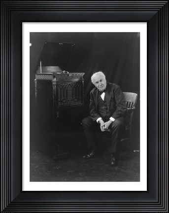 Framed Thomas Edison, seated beside phonograph Print