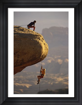 Framed View of rock climbers on the edge of a cliff Print
