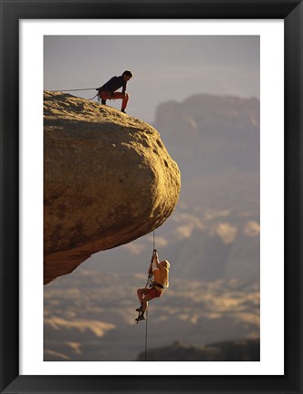 Framed View of rock climbers on the edge of a cliff Print