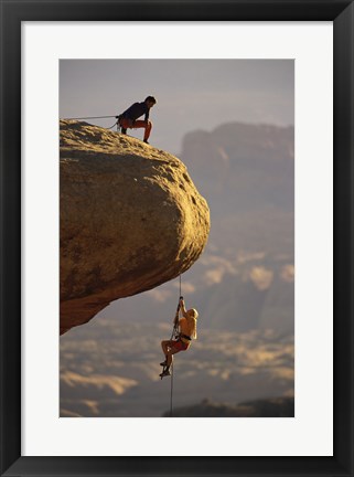 Framed View of rock climbers on the edge of a cliff Print