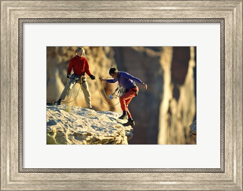 Framed Two hikers with ropes at the edge of a cliff Print