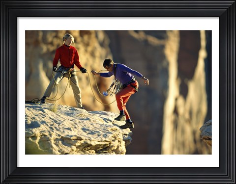 Framed Two hikers with ropes at the edge of a cliff Print