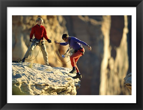 Framed Two hikers with ropes at the edge of a cliff Print