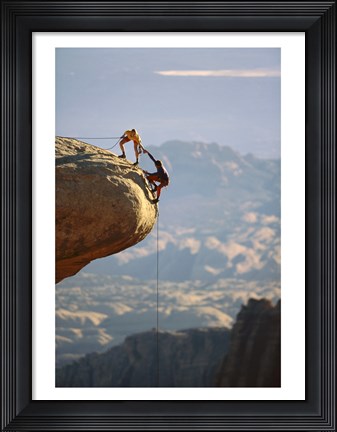 Framed Two hikers with ropes at the edge of a cliff 2 Print