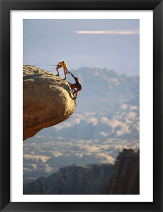 Framed Two hikers with ropes at the edge of a cliff 2 Print