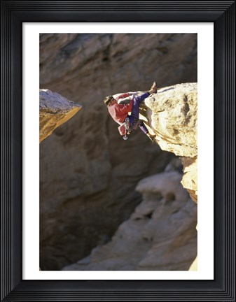 Framed High Angle View of a Man hanging off of a Summit Print