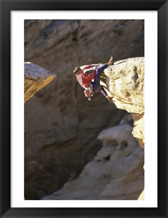 Framed High Angle View of a Man hanging off of a Summit Print