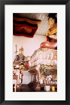 Framed Young Girl Praying in Front of a Giant Buddha Statue Print