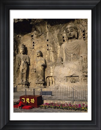 Framed Buddha Statue in a Cave, Longmen Caves, Luoyang, China with Flowers Print