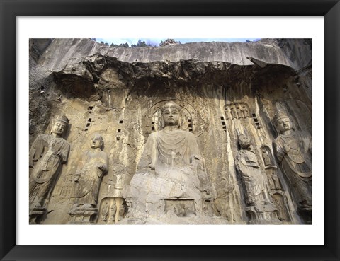 Framed Buddha Statue Carved on a wall, Longmen Caves,  ground view in China Print