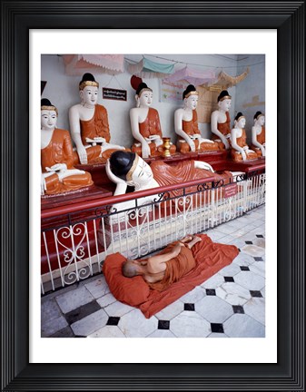 Framed Monk Sleeping in Front of Buddha Statues Print