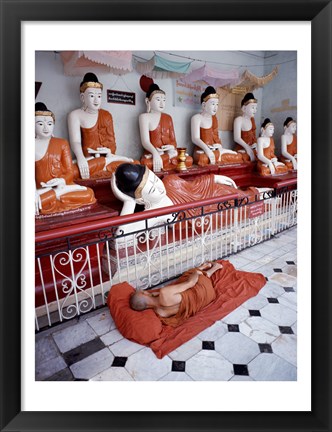 Framed Monk Sleeping in Front of Buddha Statues Print