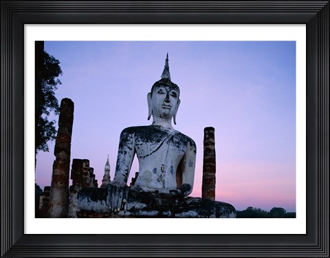 Framed Low angle view of the Seated Buddha, Wat Mahathat, Sukhothai, Thailand Print