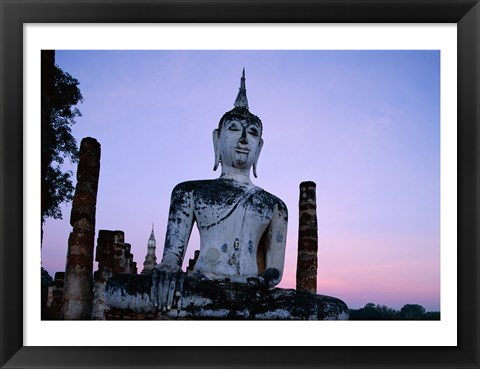 Framed Low angle view of the Seated Buddha, Wat Mahathat, Sukhothai, Thailand Print