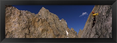 Framed Man climbing up a mountain, Grand Teton, Grand Teton National Park, Wyoming, USA Print