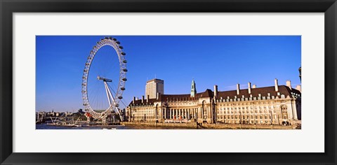 Framed Ferris wheel with buildings at the waterfront, River Thames, Millennium Wheel, London County Hall, London, England Print