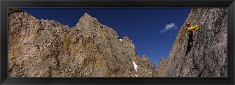 Framed Man climbing up a mountain, Grand Teton, Grand Teton National Park, Wyoming, USA Print