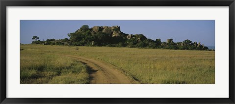Framed Road passing through a grassland, Simba Kopjes, Road Serengeti, Tanzania, Africa Print