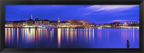 Framed Buildings at the waterfront lit up at dusk, Stockholm, Sweden Print